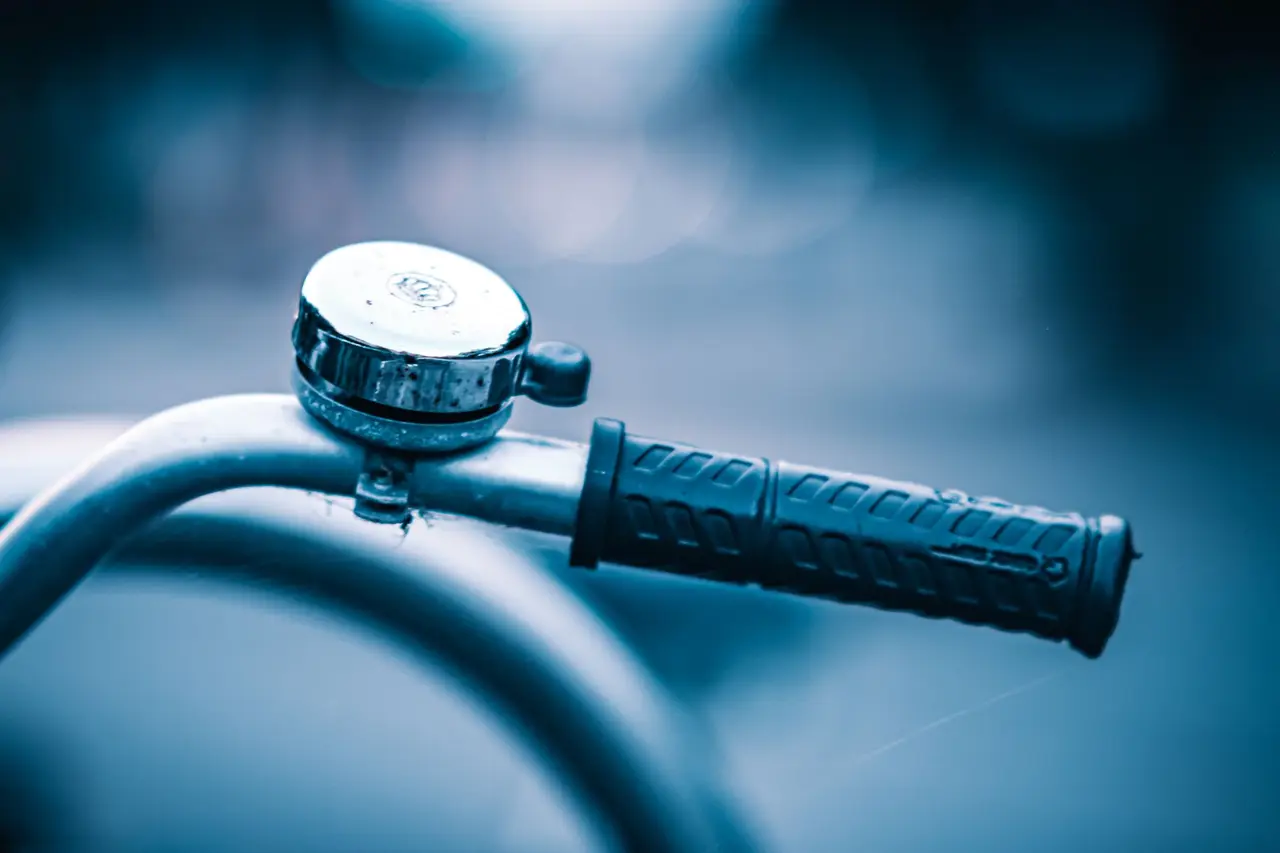 Bicycle handlebar grip and bell
